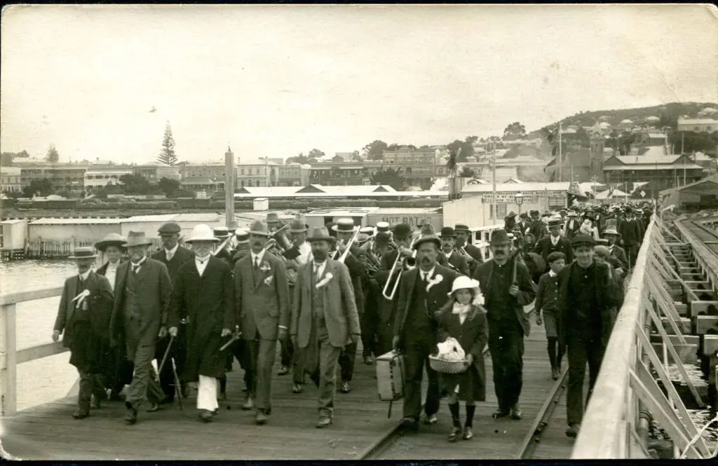 Brass Band marching on Albany Jetty with large ... Image 1++
