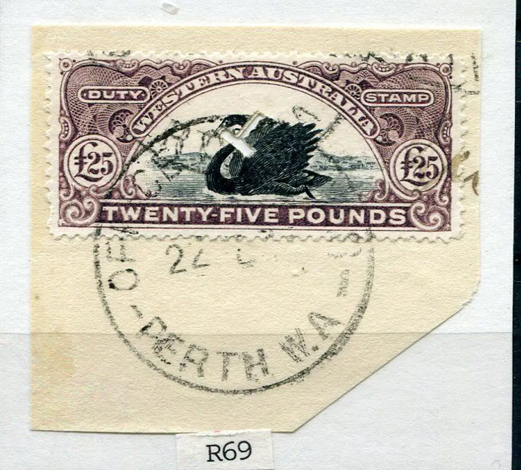 1904 £25 R69 with "T" puncture on piece. ... Image 1++