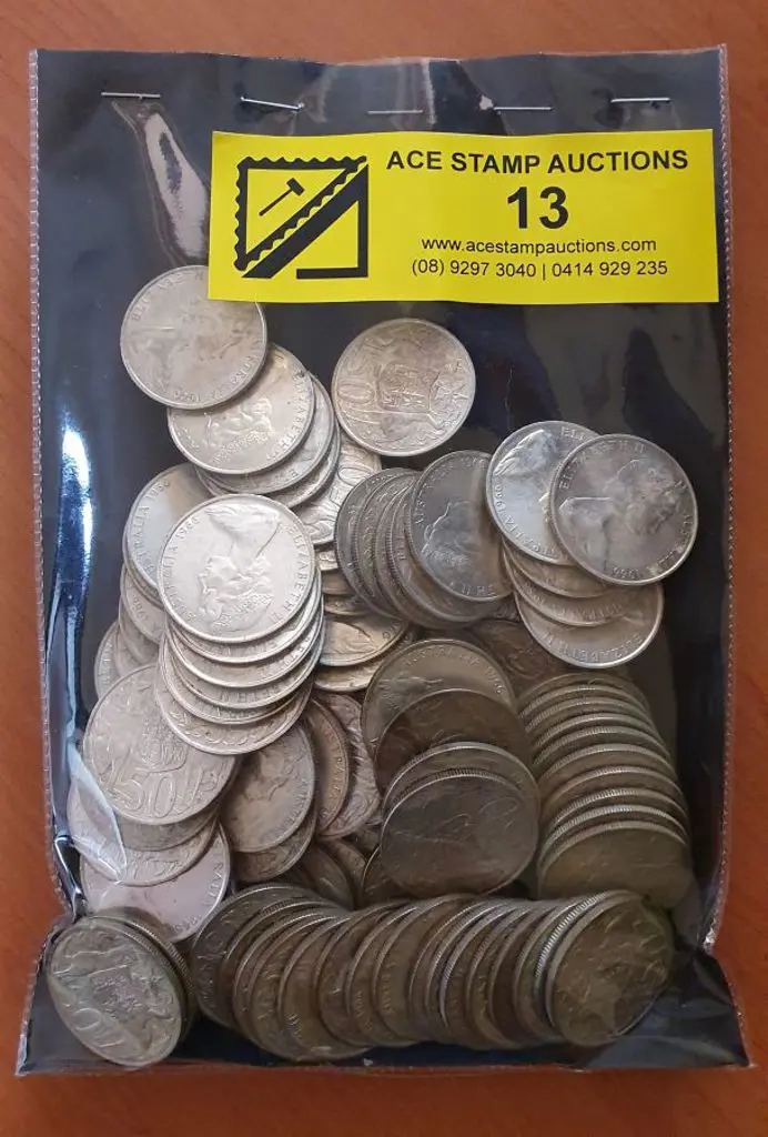 1966 50c round coins x 100 in tin. (100) Image 1++
