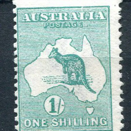 1/- blue-green with "Break in top frame over "L"" ...