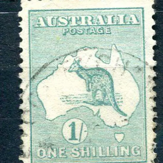 1/- green with "break right of "O" variety of ...