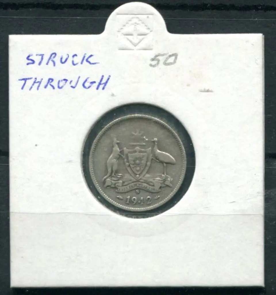 1942 Sixpence "struck through". VF Image 1++