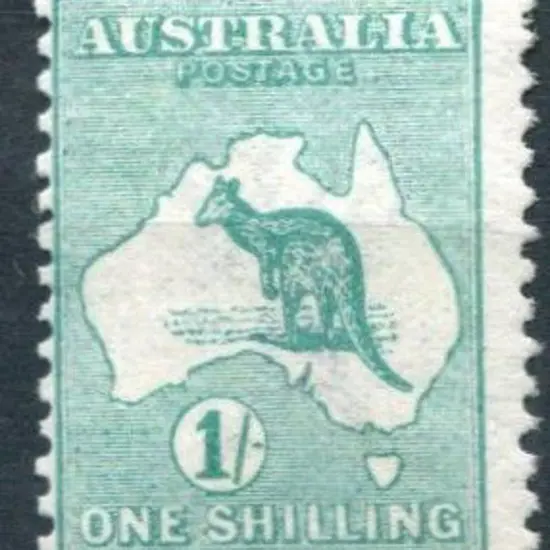 1/- blue-green with "Break in top frame over "L"" ...