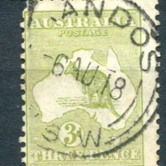 3d olive with "White flaw over "T" of "Three"" ...