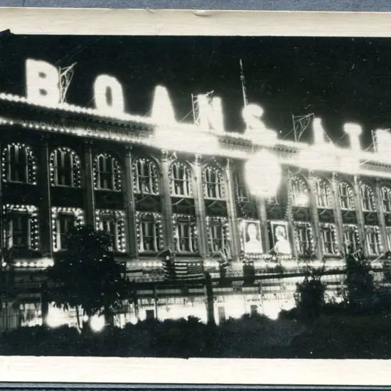 "Boans Ltd" in bright lights on this b&w night ...