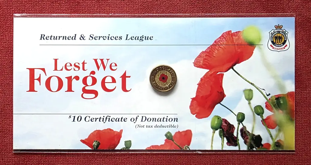 2012 $2 Red Poppy coloured coin on "Lest We ... Image 1++