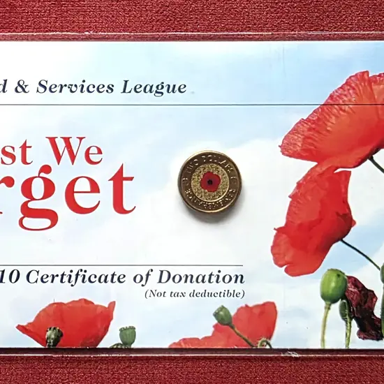 2012 $2 Red Poppy coloured coin on "Lest We ...